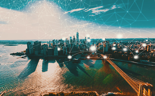 Network and connection technology concept with New York City at sunset