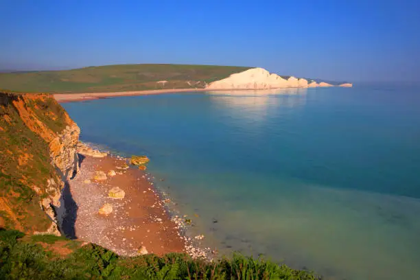 Seven Sisters chalk cliffs East Sussex uk between Seaford and Eastbourne with blue sky and sea