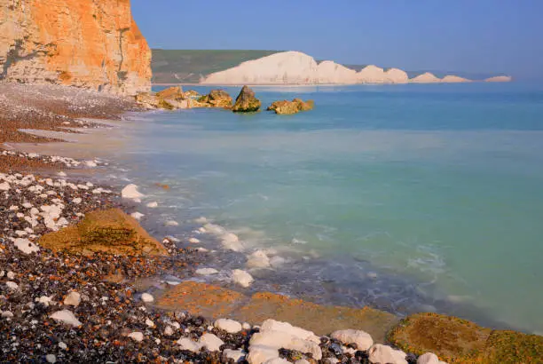 Seven Sisters chalk cliffs South Downs East Sussex uk from the beach opposite
