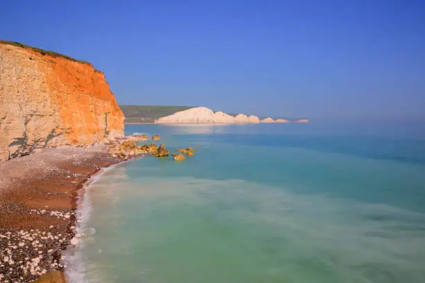 Seven Sisters chalk cliffs East Sussex uk with clear blue turquoise sea