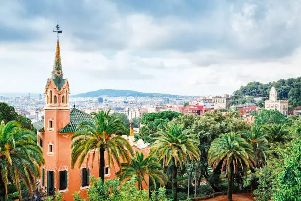 Photo of Barcelona landmarks, Spain. House where lived famous and outstanding architect Antonio Gaudi placed in park Guell park in Barcelona, Spain. Extremely popular travel destination in Barcelona, Europe.