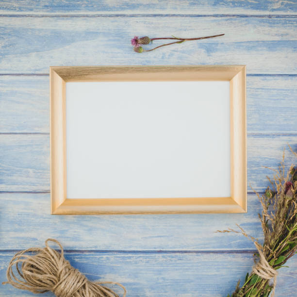 istock Golden frame mock up with autumn flowers 1006133472