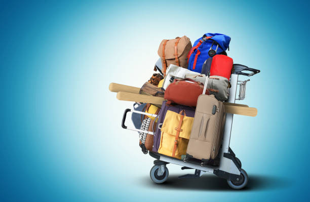 Luggage tourists with big suitcases on a cart