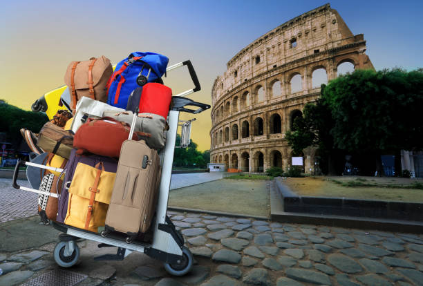 Airport cart with a bunch of bags and suitcases in Rome