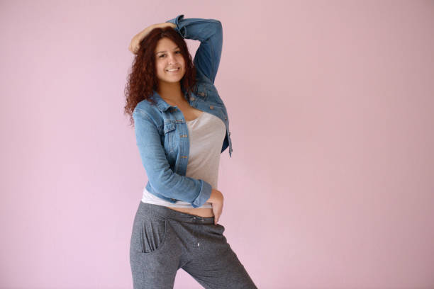 istock Beautiful girl on the pink background 1006151332