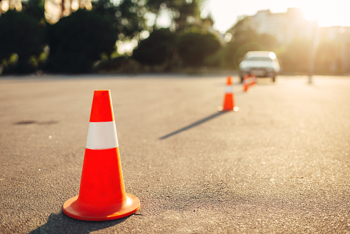 Cones for the examination, driving school concept. lesson for novice car drivers, test for beginner