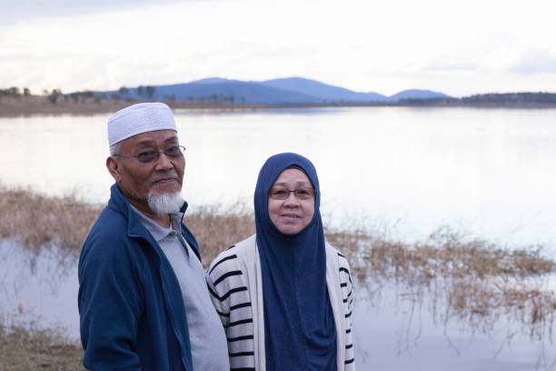 istock Elderly Malay couple standing at Lake Wivenhoe 1006153208