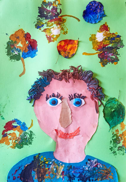 Childs drawing. Portrait of a father on a green background with leaves