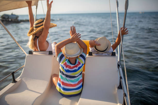 istock Mother and two sons on a pedal boat 1006179228