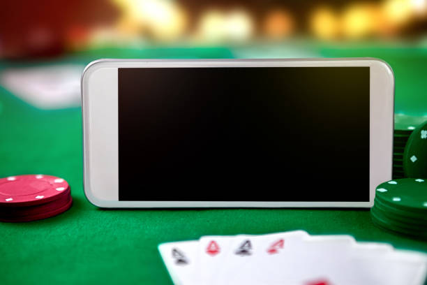 istock Smartphone with playing cards and chip cards 1006185956