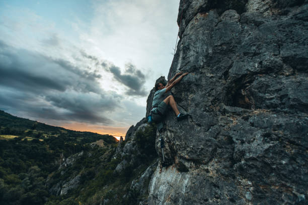 istock Man with prostetic leg mountain climbing 1006196960