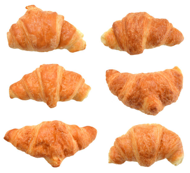 istock Fresh and tasty croissant over white background 1006200438