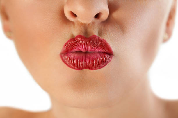 istock gorgeous red lips pucker up for kiss 1006200940