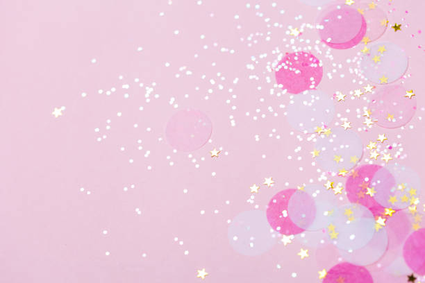 istock Pink pastel confetti and sparkles background. 1006205088