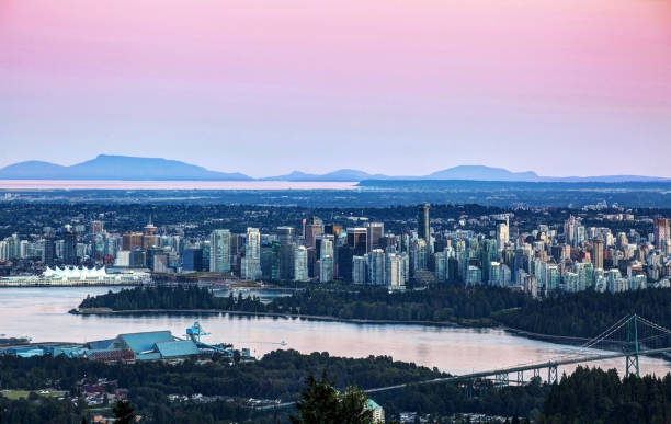 istock evening pink glow over Vancouver, BC, Canada 1006205214