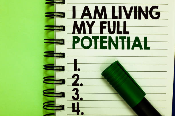 istock Handwriting text I Am Living My Full Potential. Concept meaning Embracing opportunities using skills abilities Written letters and numbers on notepad laid green marker green back. 1006208222