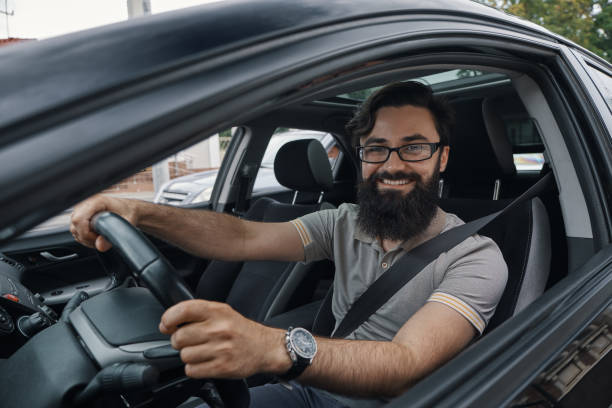 istock Happy car driver with fastened seat belt 1006208948