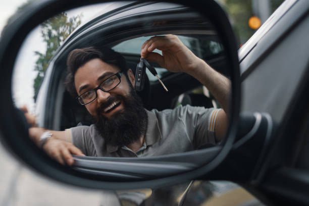 istock Charismatic man holding car keys 1006209020