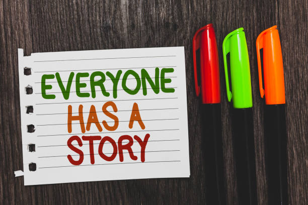 Handwriting text Everyone Has A Story. Concept meaning Background storytelling telling your memories tales Colorful words with white page red green orange pen on blackish wooden desk.