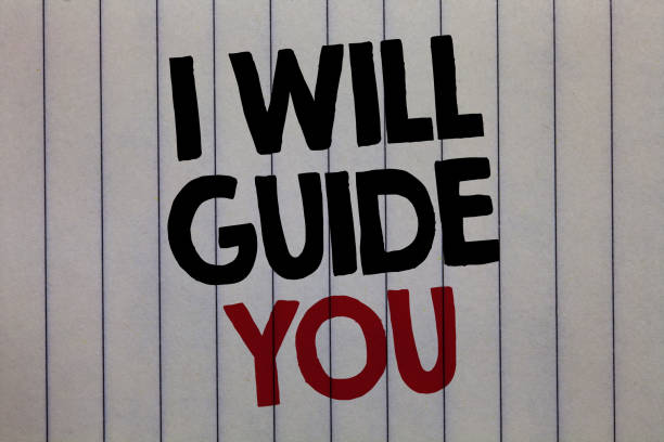 istock Handwriting text writing I Will Guide You. Concept meaning Help showing a route Influence to do or think something white vertical paper written three words with black and red color. 1006212944