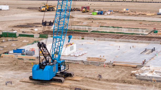 istock Blue Crane and Construction Site Aerial View with Construction Equipment 1006220272