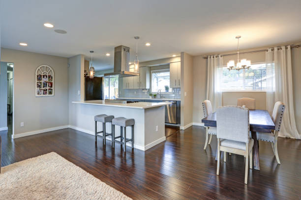 istock Open floor plan interior with shiny hardwood floor. 1006223162