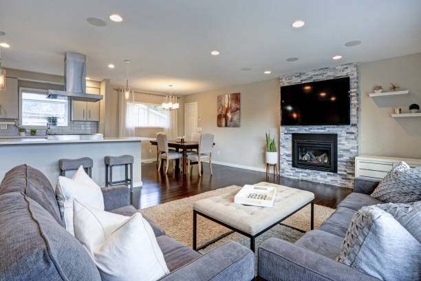 istock Beautiful grey living room with stone fireplace. 1006225438