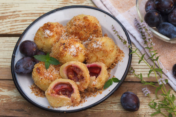 istock Plum dumplings made of leavened dough and fresh plums 1006225472