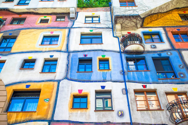 Hundertwasser house with a garden upstairs in Vienna, Austria Beautiful colorful Hundertwasser house with a garden upstairs in Vienna, Austria hundertwasser haus in vienna austria stock pictures, royalty-free photos & images