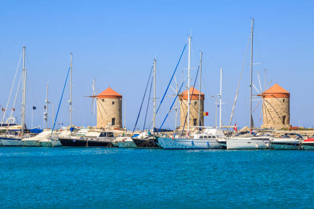 istock Windmills in mandraki port in Rhodes, Dodecanese, Greece 1006226506