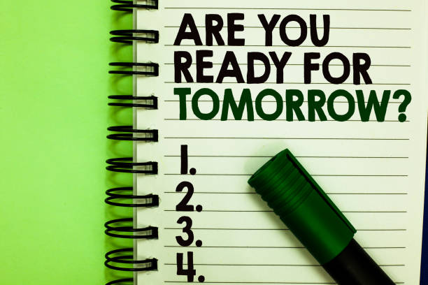 istock Handwriting text Are You Ready For Tomorrow question. Concept meaning Preparation to the future Motivation Written letters and numbers on notepad laid green marker green back. 1006226610