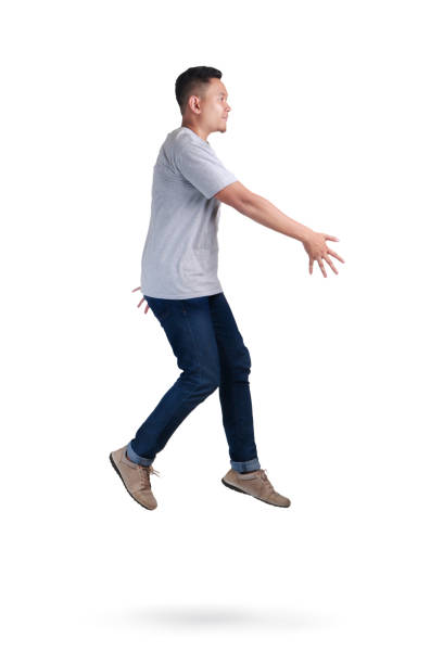 istock Levitation. Young Man Walking Jumping on Air 1006231188