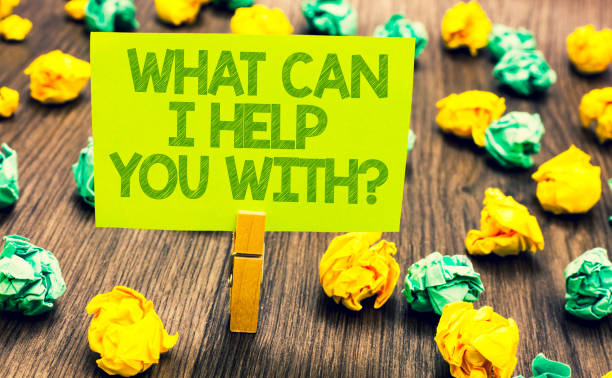 istock Handwriting text What Can I Help You With question. Concept meaning Offering assistance Experts advice ideas Paperclip retain written words yellow paper paper lobs laid on wooden floor. 1006240922