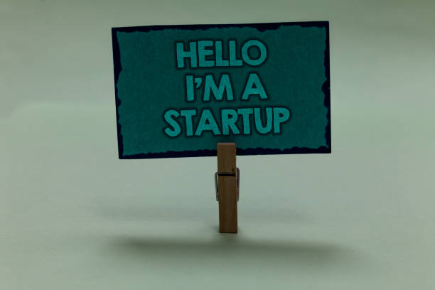 istock Writing note showing Hello I am A Startup. Business photo showcasing Entrepreneur starting business Presenting New project paperclip grip black lined green page with outlines grey background. 1006240930