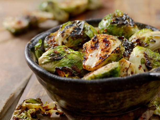 bbq brussels sprouts with grainy mustard, honey glaze - roasted imagens e fotografias de stock