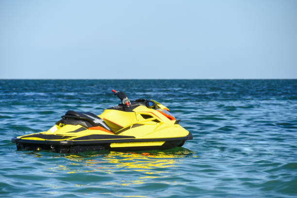 Water scooter floats on waves in sea water Water scooter is floating on the black sea near a beach pomorie stock pictures, royalty-free photos & images