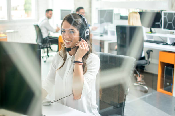istock Happy smiling female customer support phone operator at workplace 1006243554