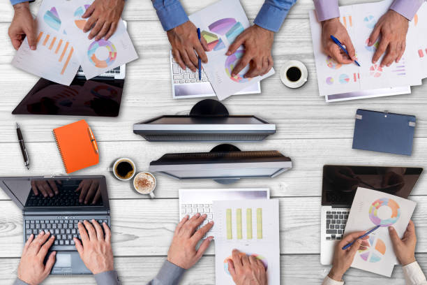 istock High angle view on business people working together 1006243948