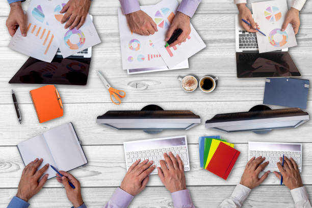 istock Top view on business people working together 1006243958