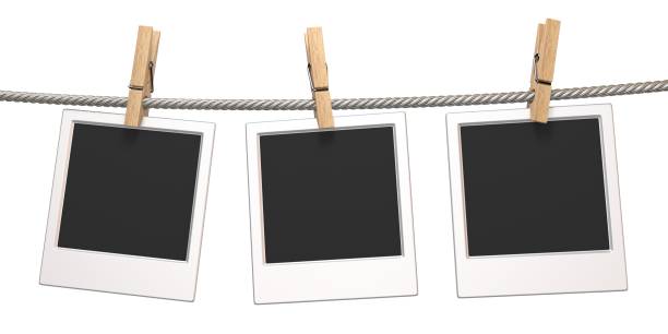 istock Clothes pin and three blank photo papers hanging on rope 3D 1006257692