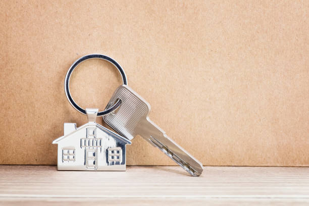 istock House Key And Key chain On Wooden Table 1006257980