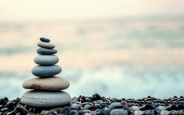 istock made of stone tower on the beach and blur background 1006260736