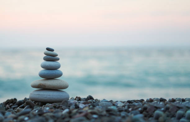 istock made of stone tower on the beach and blur background 1006260786