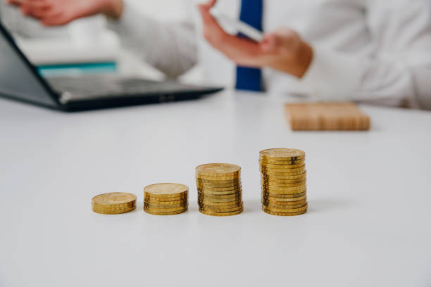 istock Golden coins on the table. 1006273898