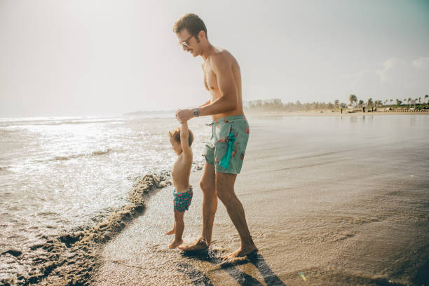 istock Father and son at the beach 1006273968