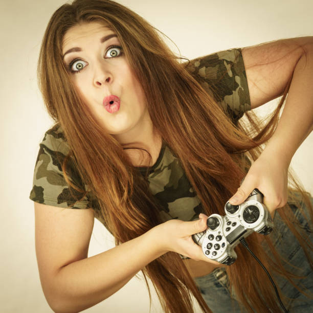istock Gamer woman holding gaming pad 1006274224