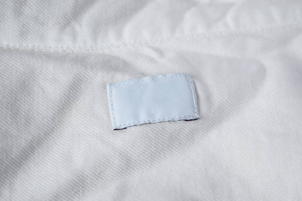 istock White blank laundry care clothes label on cotton shirt 1006276748