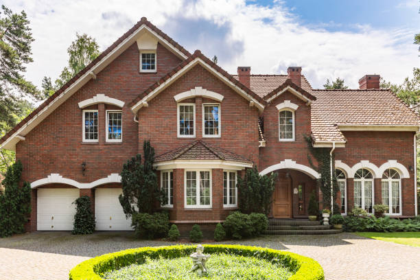 Front view of english building during summer with garden Front view of english building during summer with garden the hamptons stock pictures, royalty-free photos & images