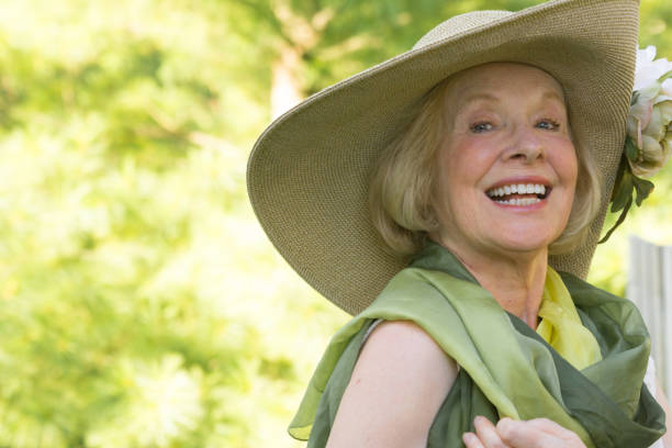 istock Senior woman wearing a big hat 1006281650