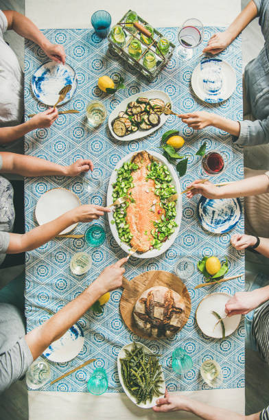 istock Family or friends having seafood summer dinner 1006284184